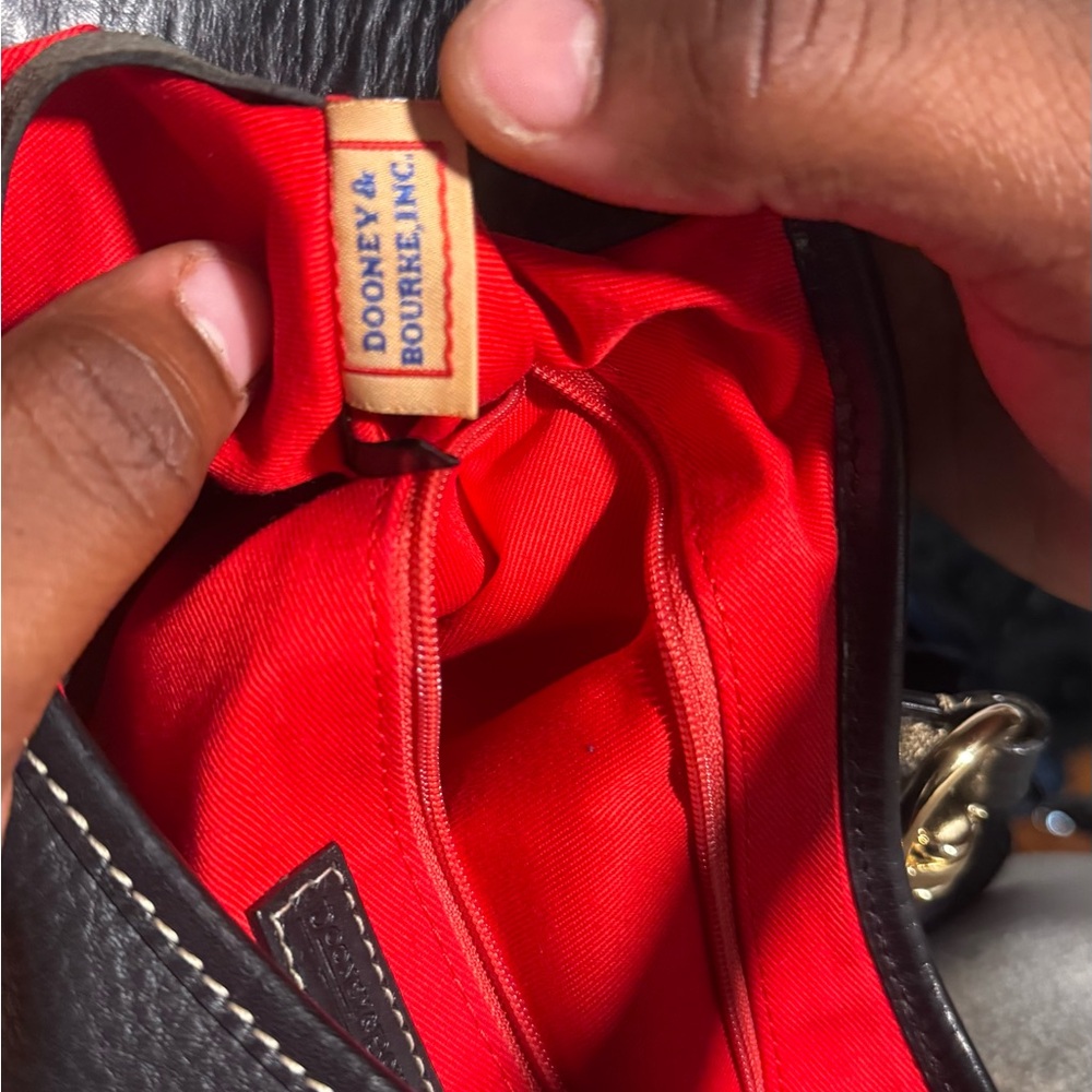 Dooney & Bourke Black Leather Bag with Red Interior